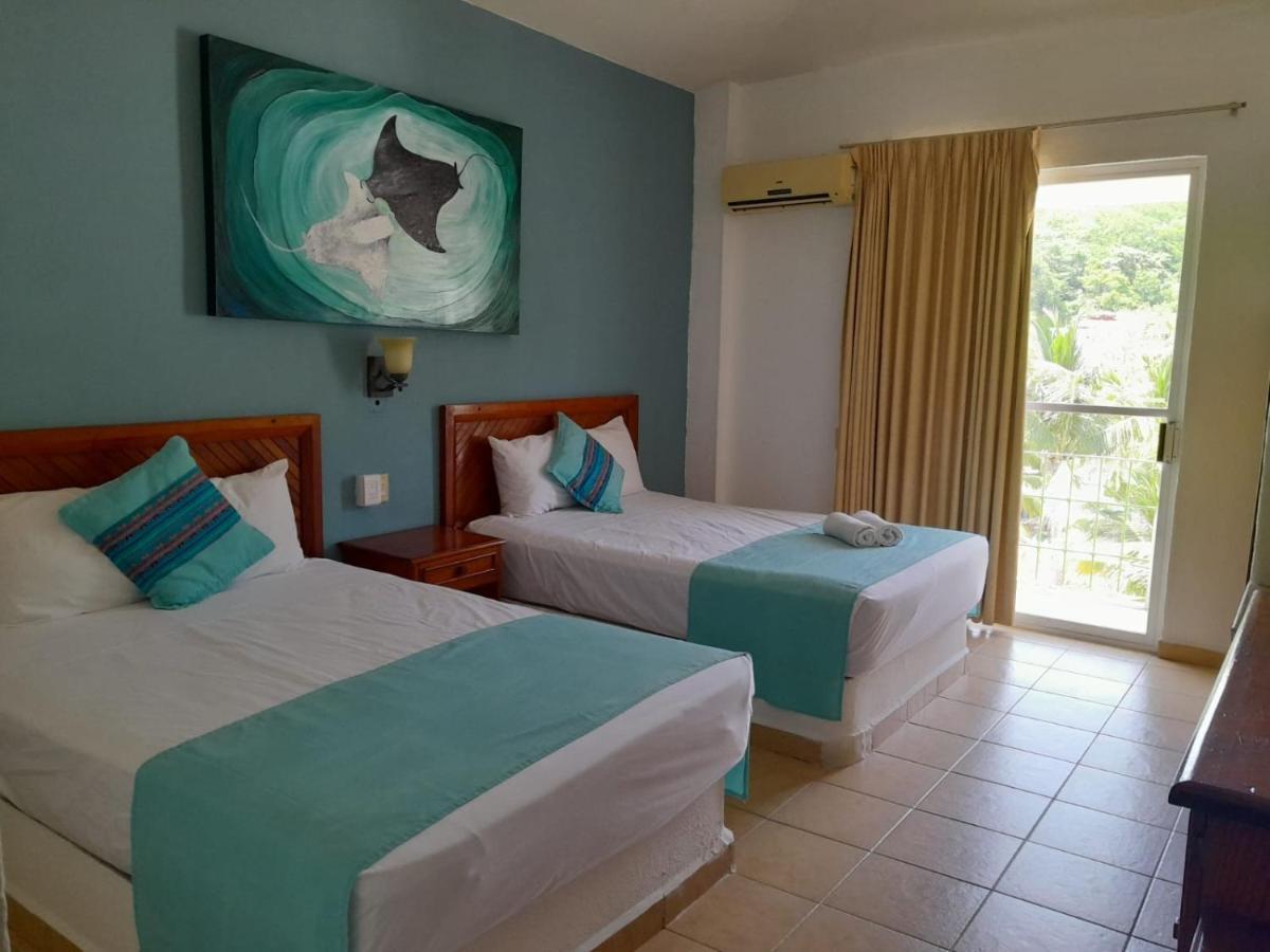 Hotel Arenas Del Pacifico ซานตา ครูซ ฮัวทุลโก ภายนอก รูปภาพ